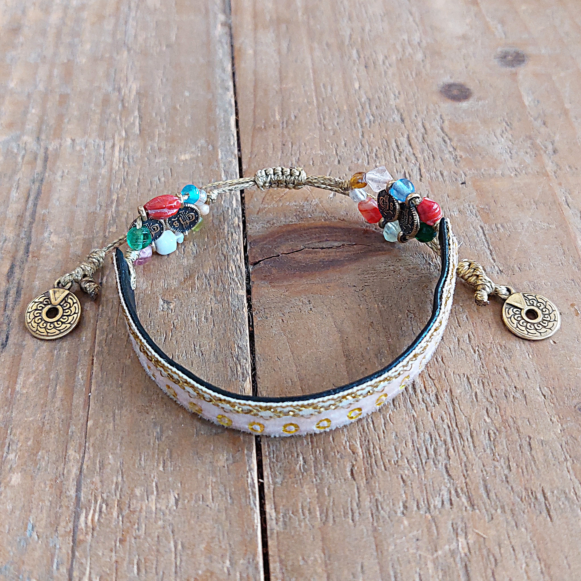Bracelet with ribbon, metal coins and glass beads